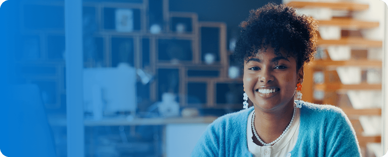 A talent smiling in a workspace, representing jobs built around your skills.
